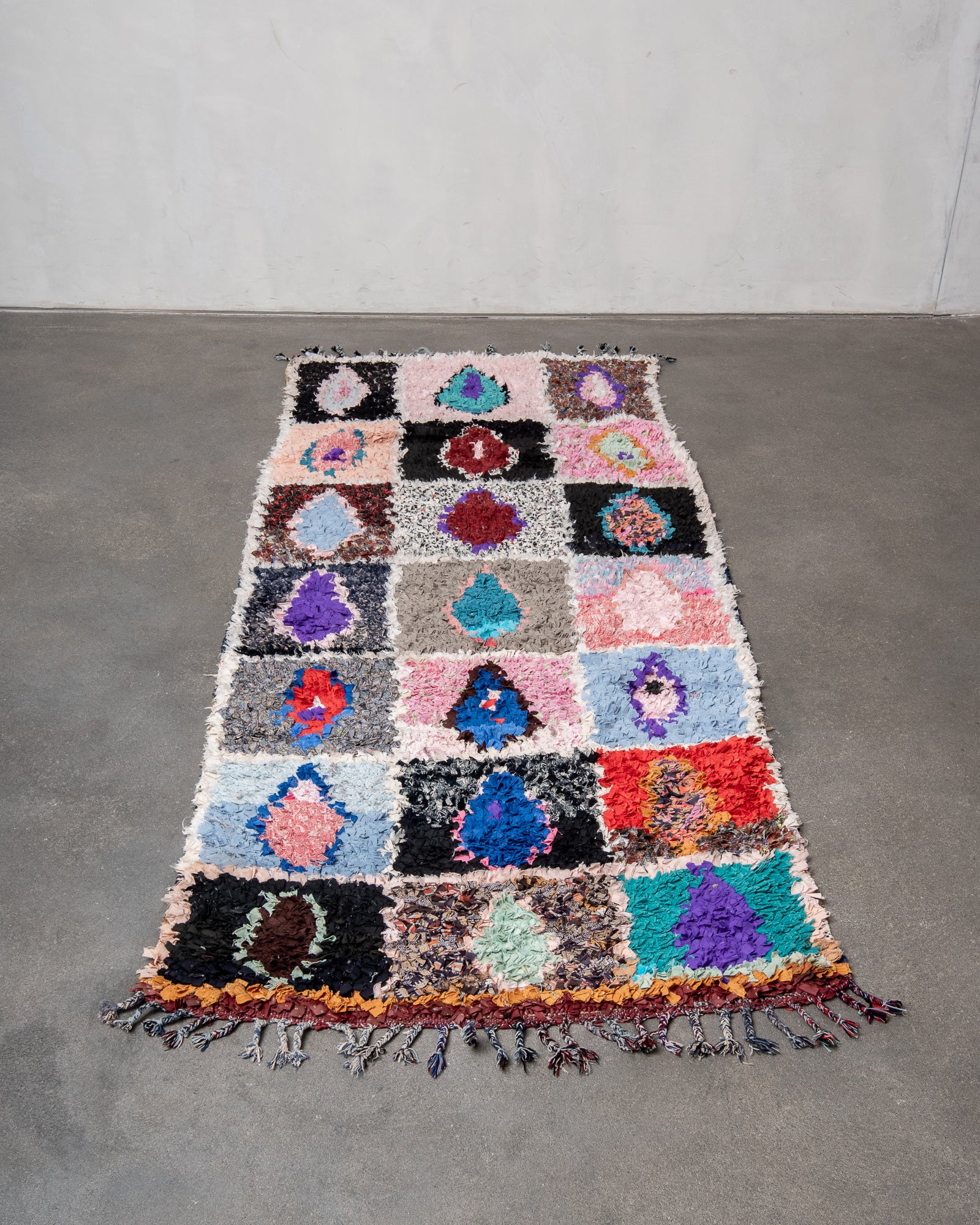 Modern designer vintage handcrafted cotton Berber rug from Morocco. Boucherouite with beautiful colors and patterns.